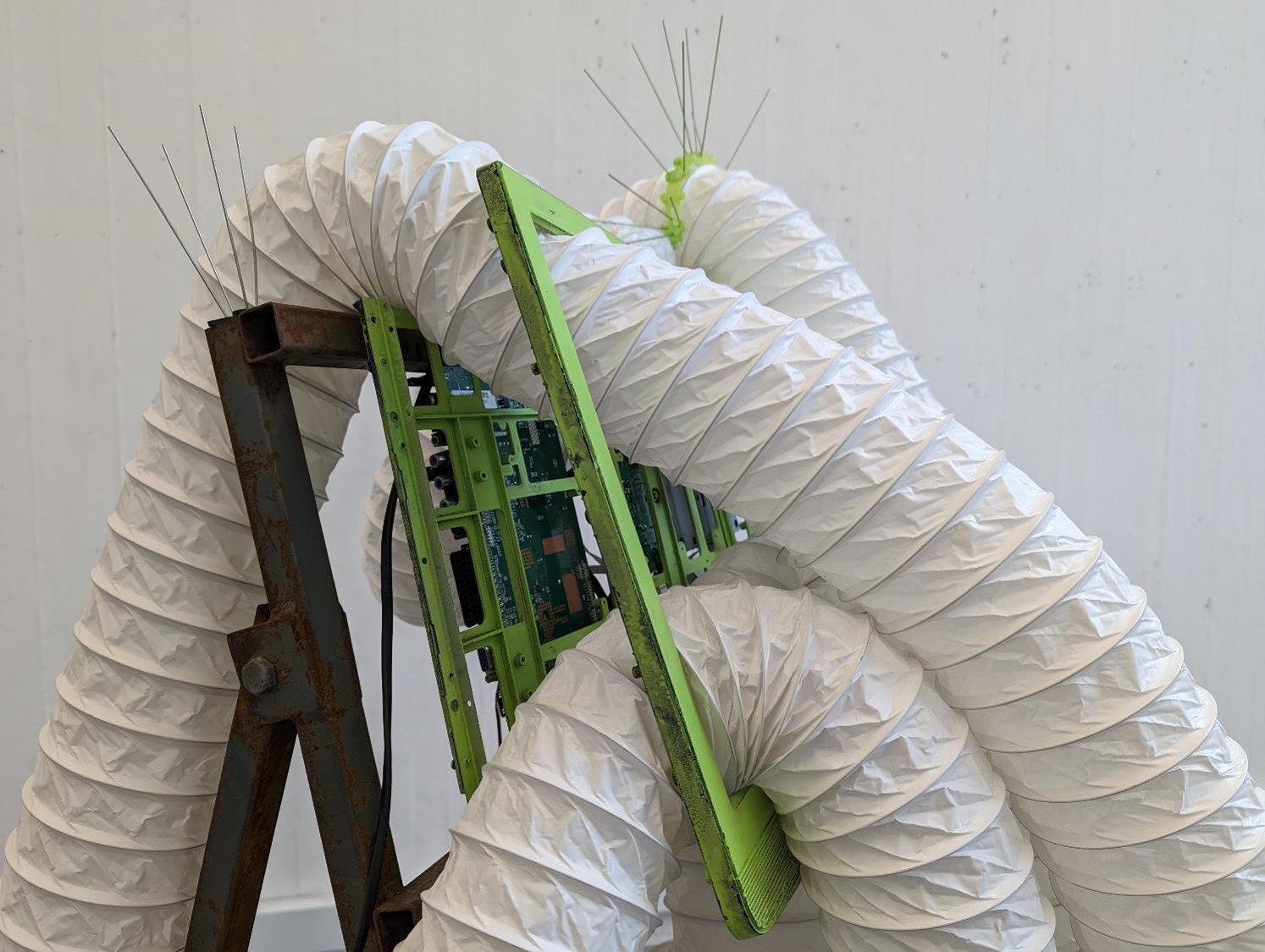 Ventilation tubes mounted on a discarded sign holder.