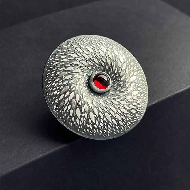 Blacken Spiral Silver Brooch with Garnet in the center, Jiahui Huang