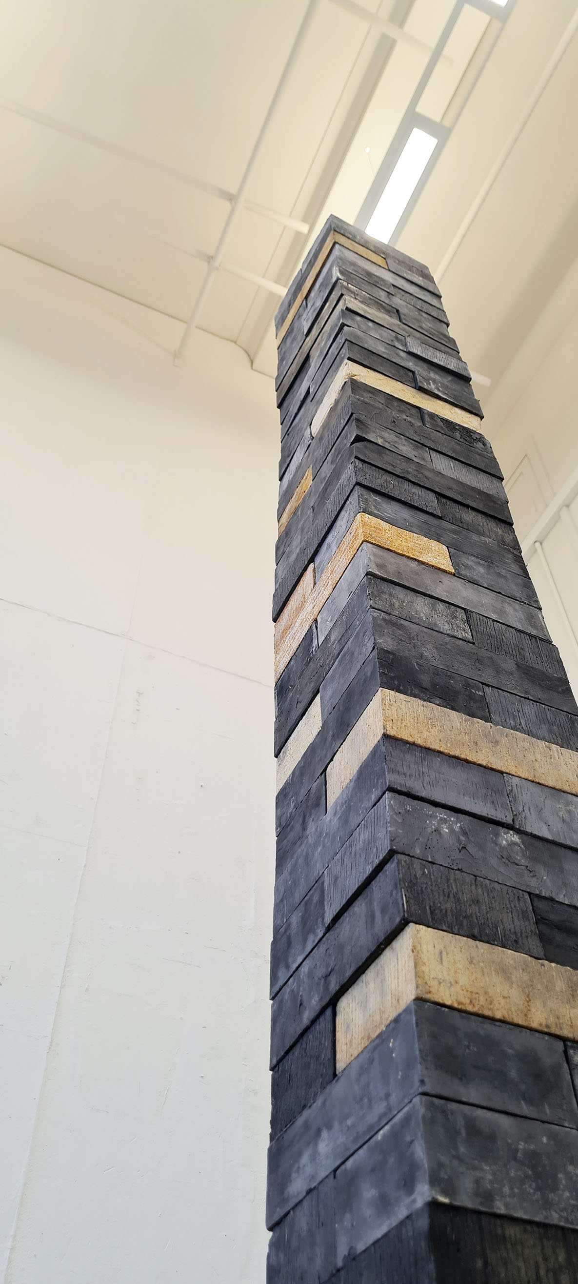 stack of black and rust bricks, 6 foot tall