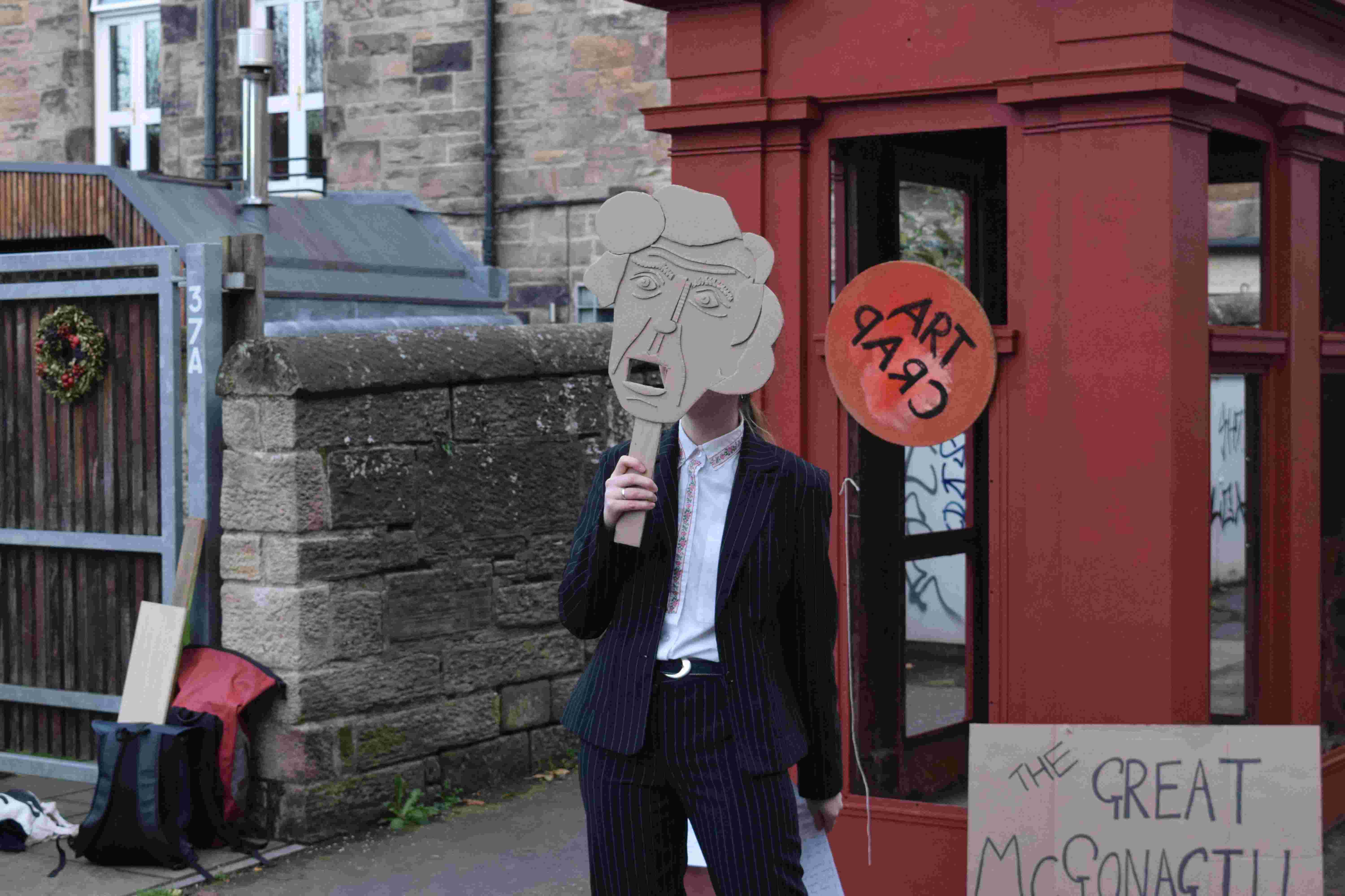Artist with a cardboard mask