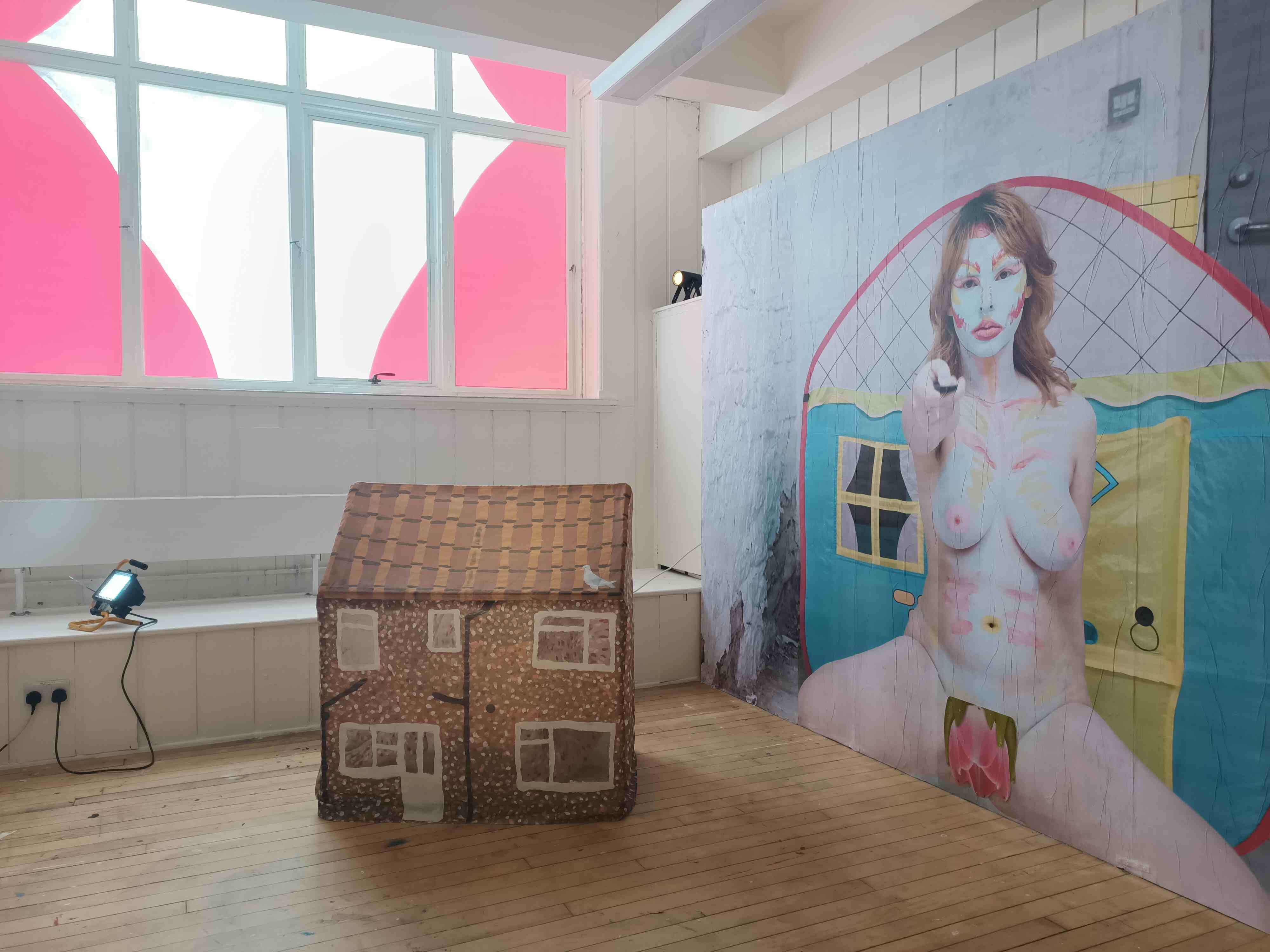 Wide shot of three artworks installed in an ECA sudio.
