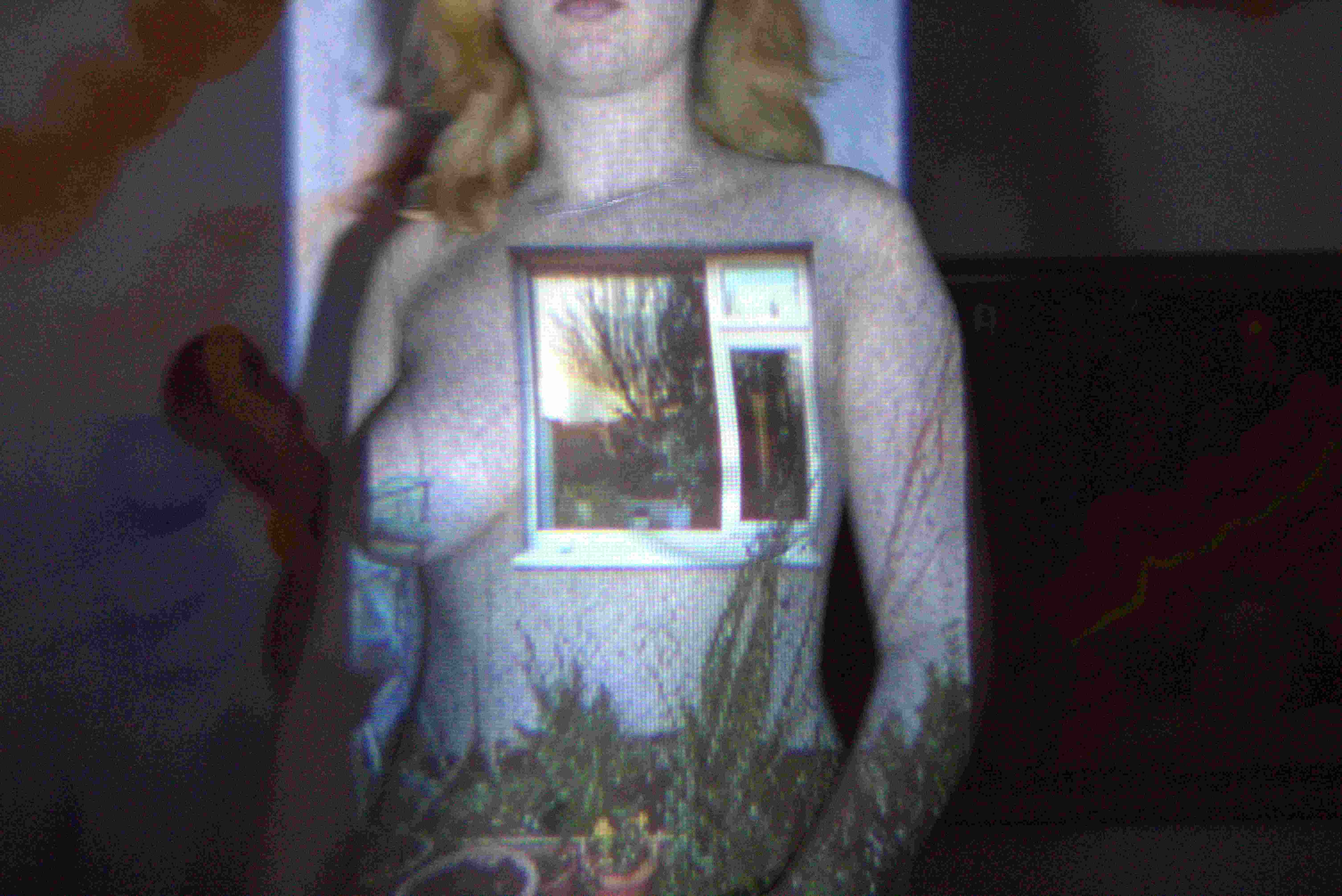 a window projected onto artists torso