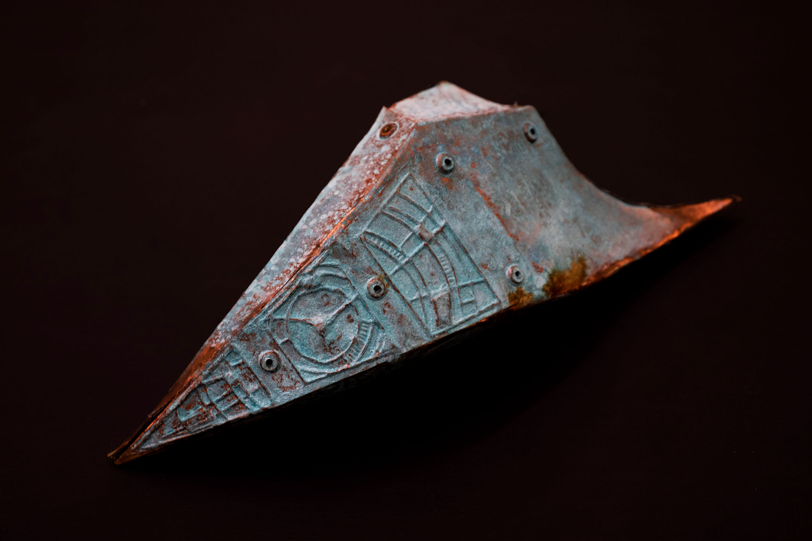 close up of patinaed copper relic 