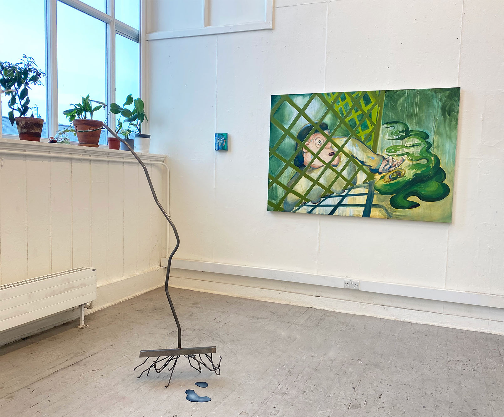 Image of paintings Scrumping, Hairy and Wandering Rake installed in the Greenhouse Collective exhibition, organised by Fiona Goss and Henry Jones, 2024. 