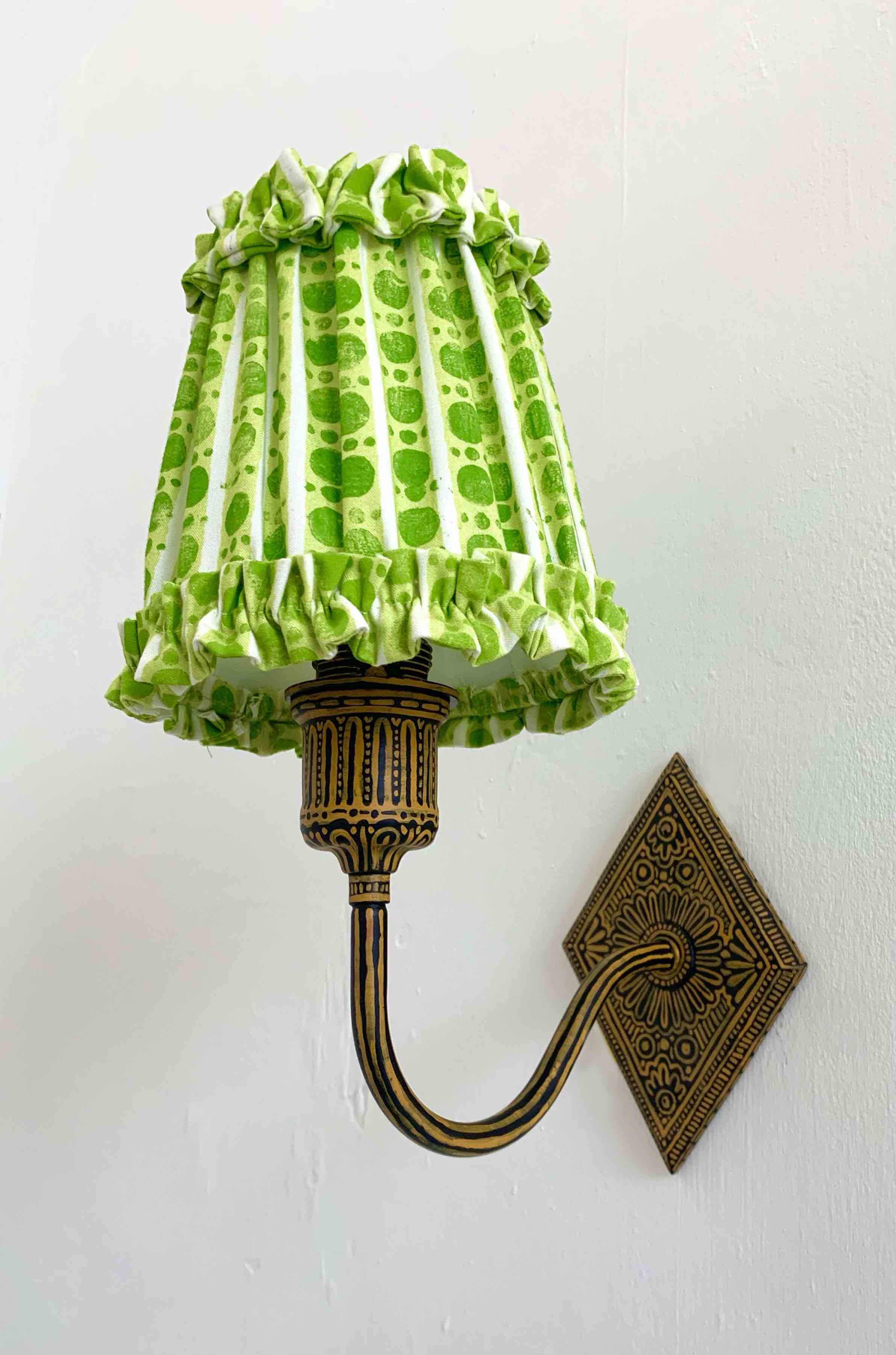 wall sconce with green lampshade