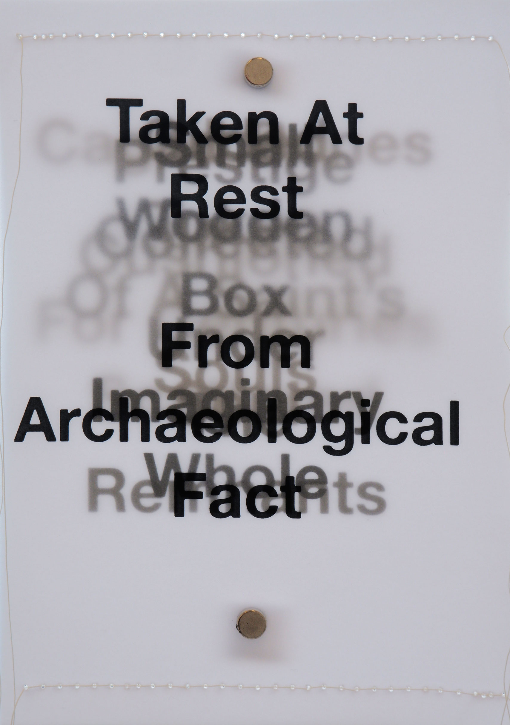 Layers of black text backlit on tracing paper with white stitching along short sides