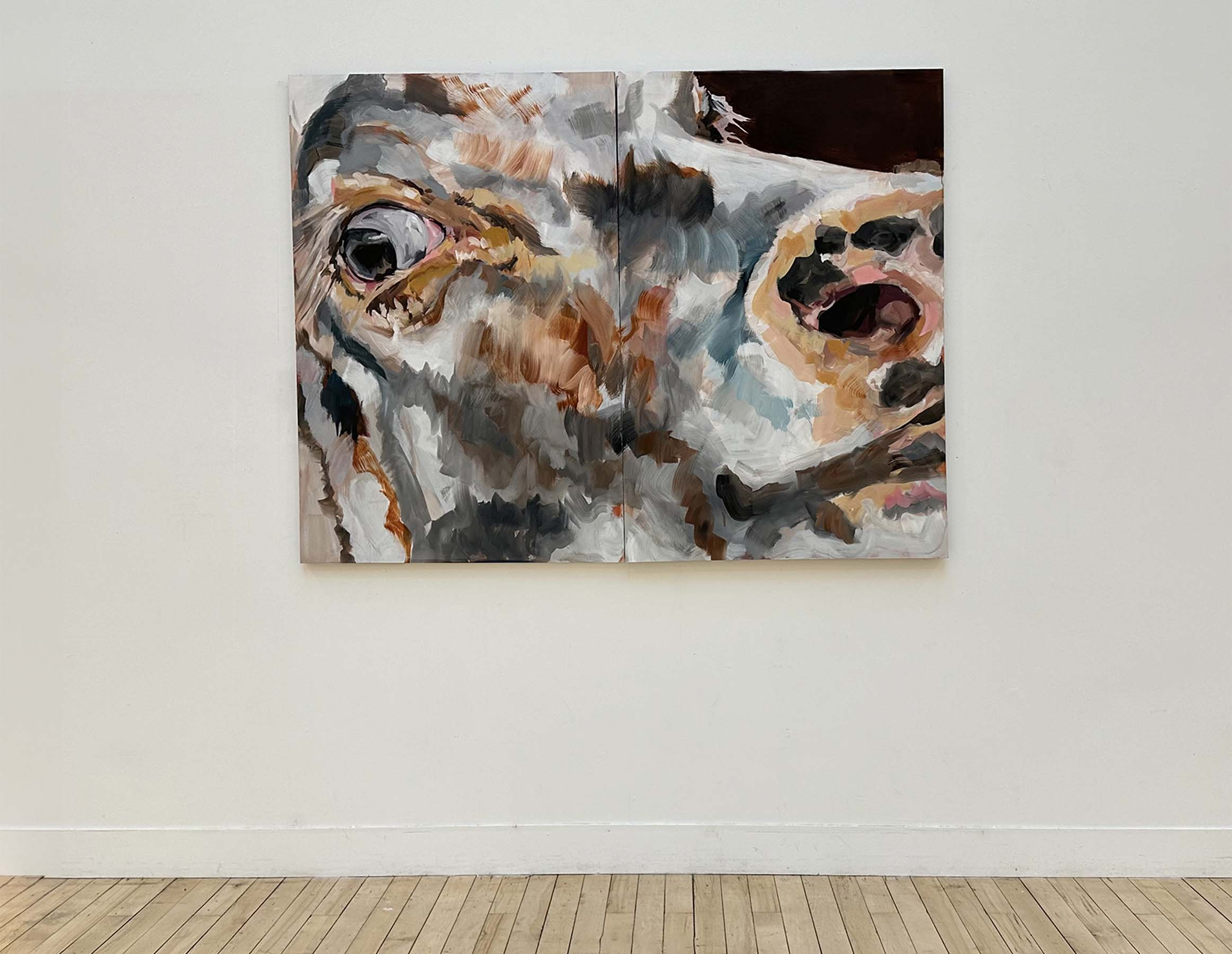 oil painting of closeup of cow's face on linen canvas displayed on a wall