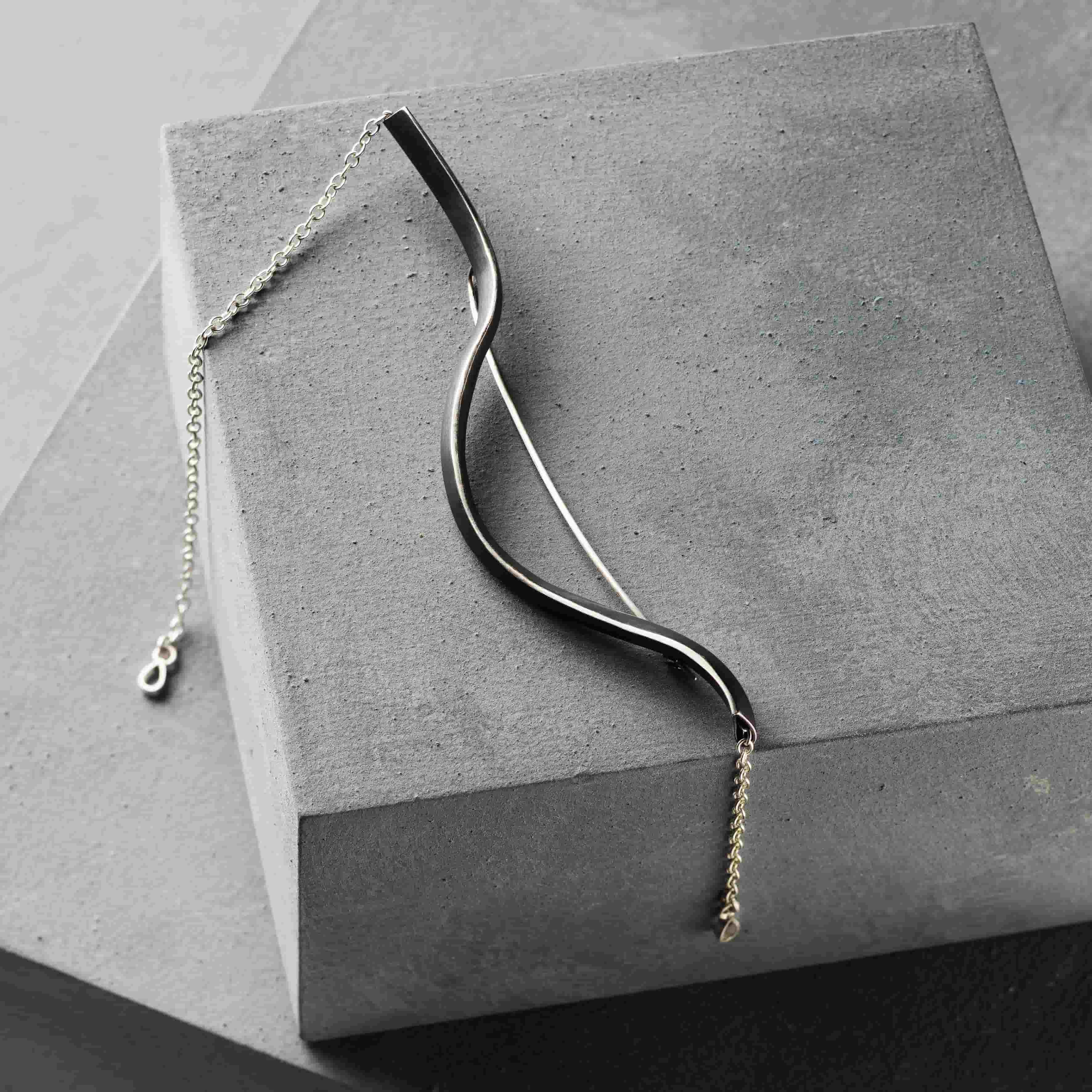 The Weight of Pears | Brooch | Silver | Pear-Shaped Tube with Loose Chain and Pear Terminals