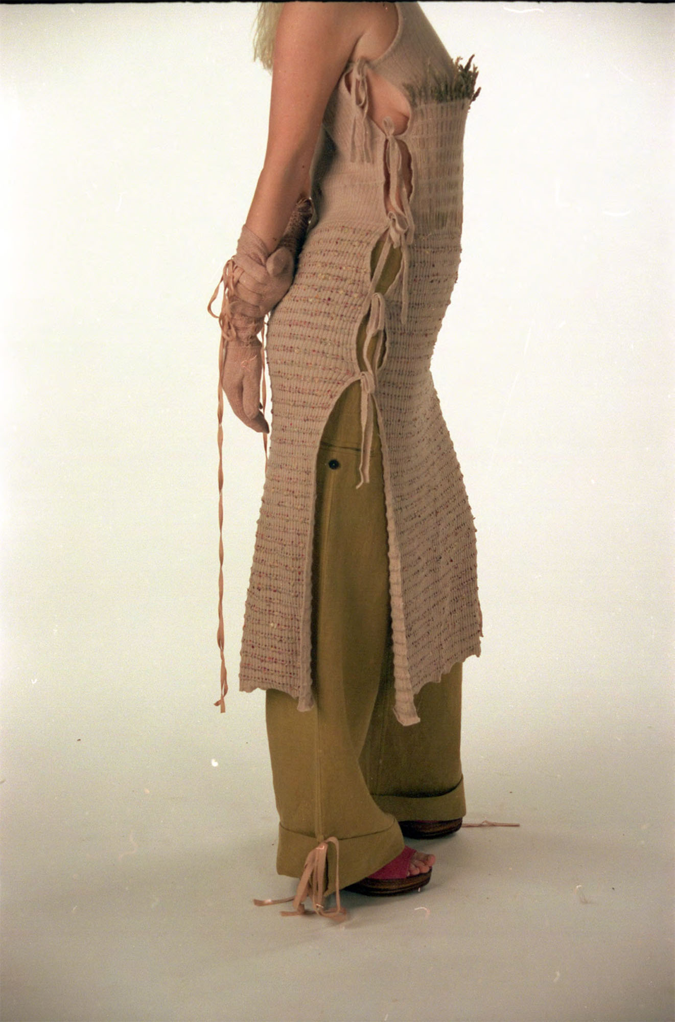 Knitted dress dyed with avocado pits, paired with linen trousers dyed with red onion skins.