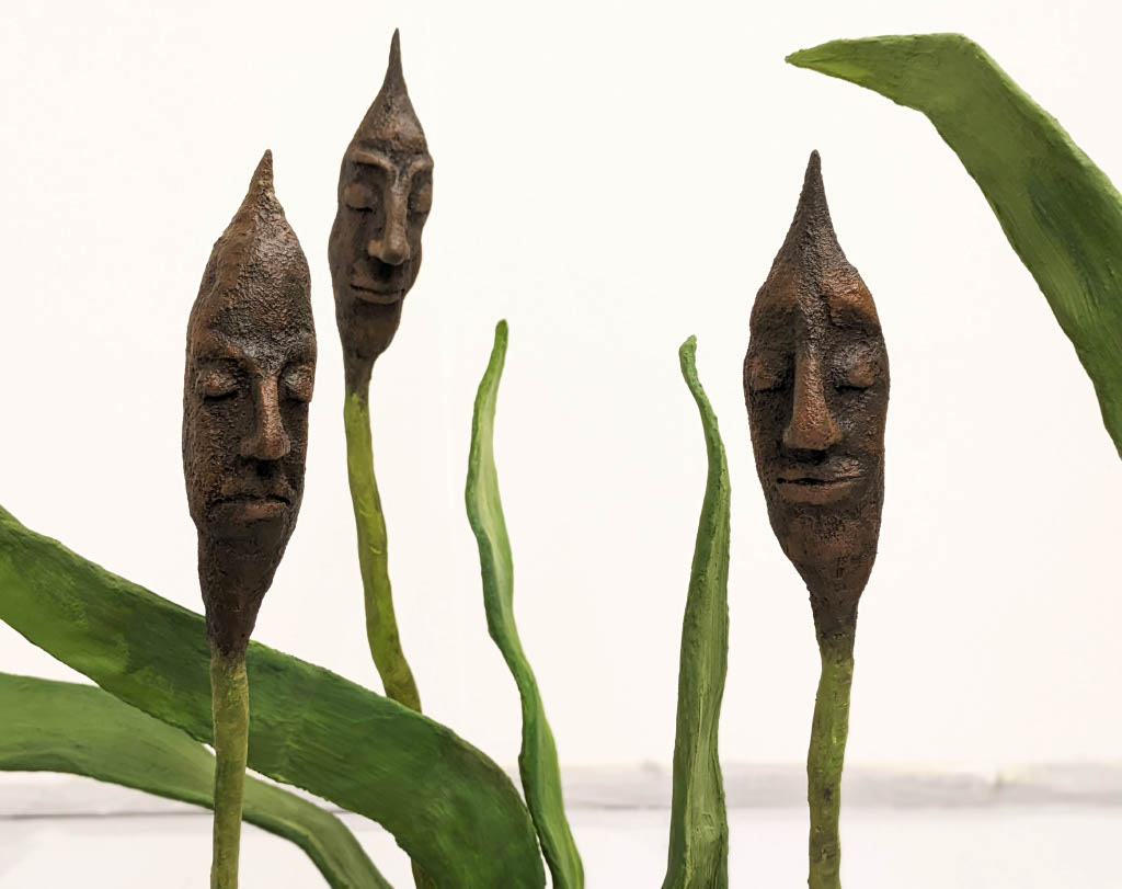 Three Bullrushes with human faces