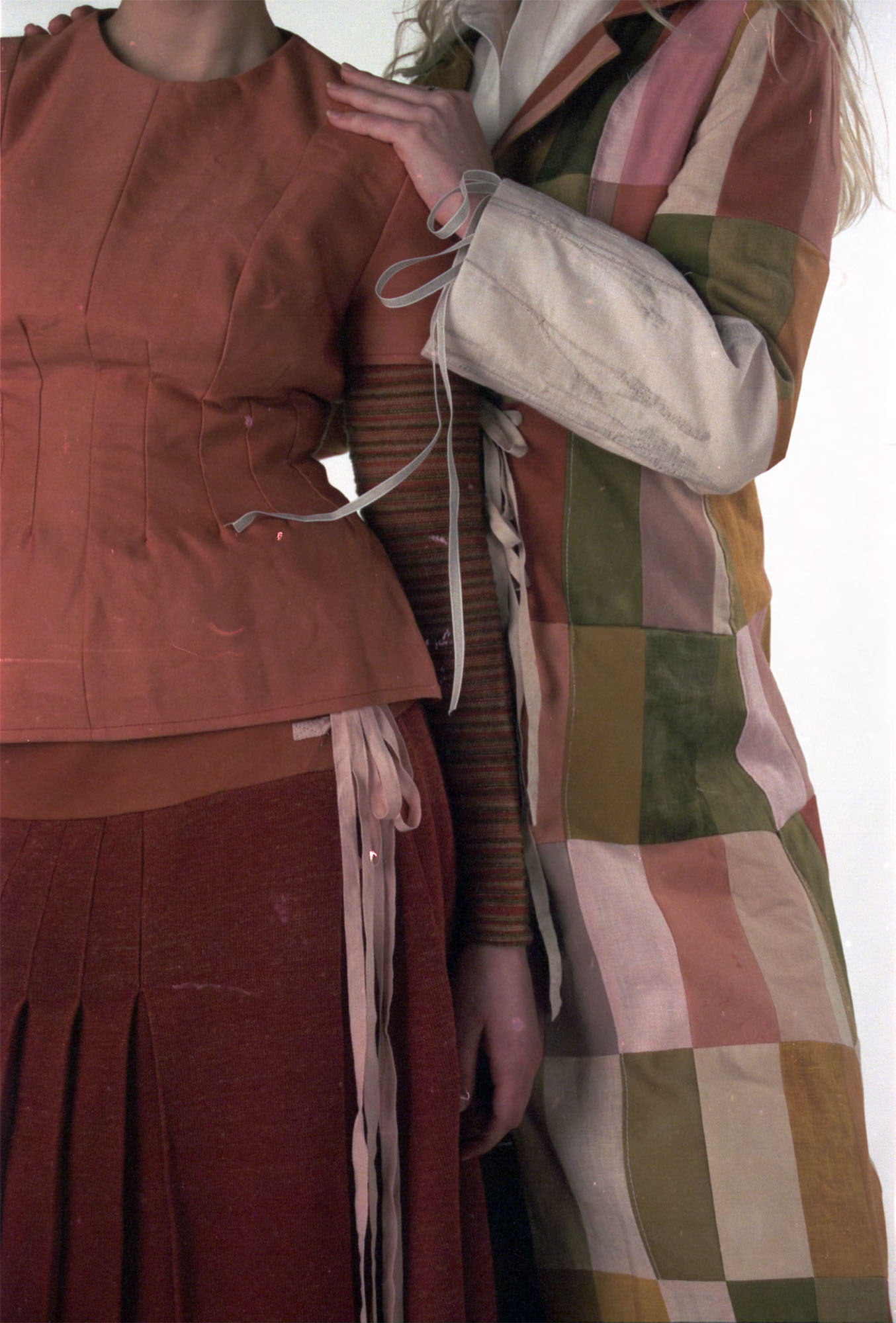 Wool top and knitted kilt dyed with madder, with striped base layer knitted with dyed scrap yarns, Patchwork coat made from dyed fabric scraps of wool, cotton and linen.