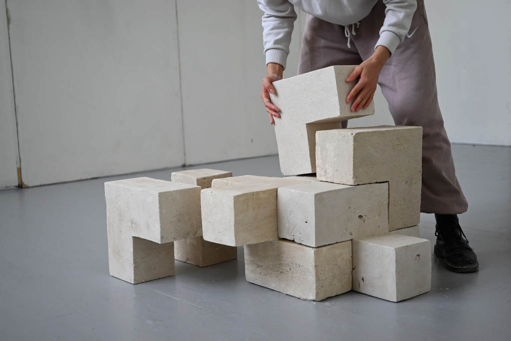 Demonstrating interlocking structural elements.