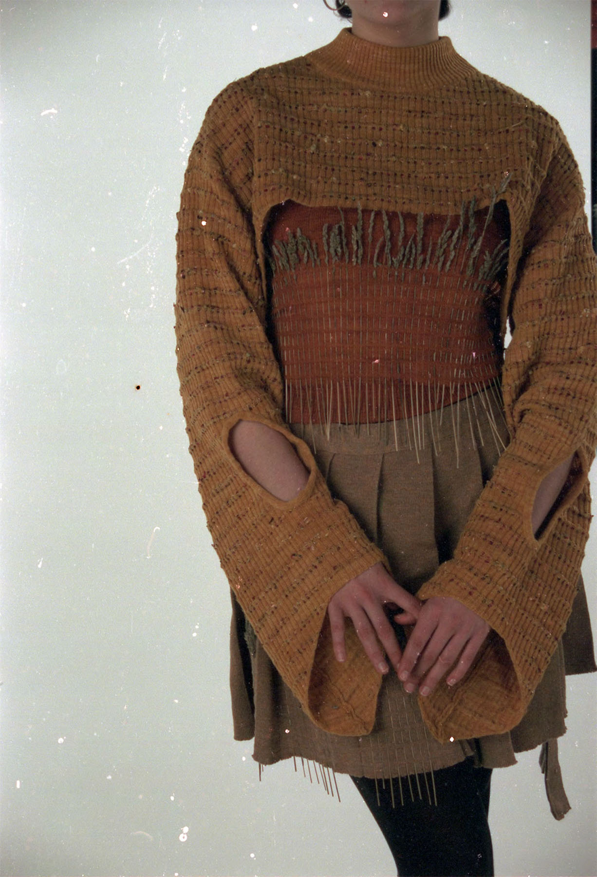 Knitted jumper and vest dyed with yellow onion skins, paired with knitted skirt made from undyed cashmere and silk.