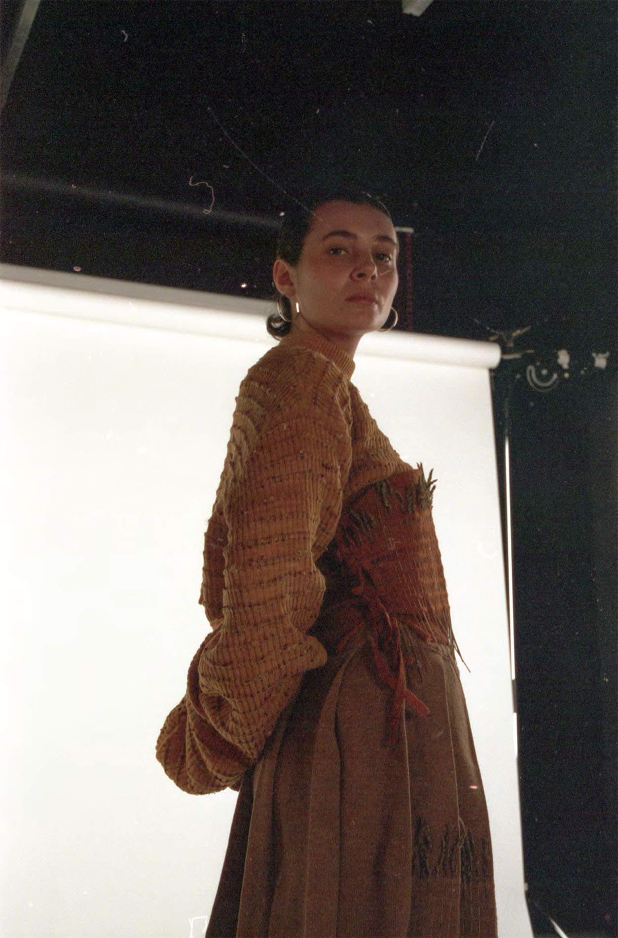 Knitted jumper and vest dyed with yellow onion skins, paired with knitted skirt made from undyed cashmere and silk.