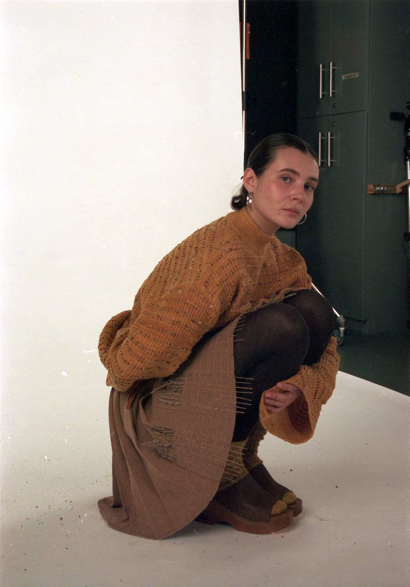 Knitted jumper and vest dyed with yellow onion skins, paired with knitted skirt made from undyed cashmere and silk.