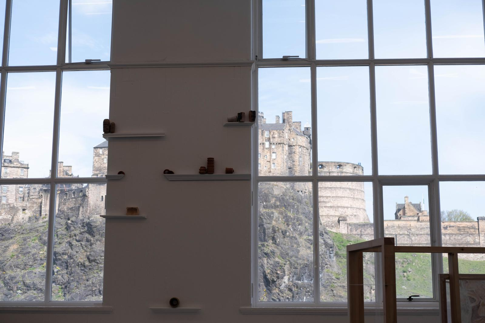Ceramic installation aligning with the castle backdrop.