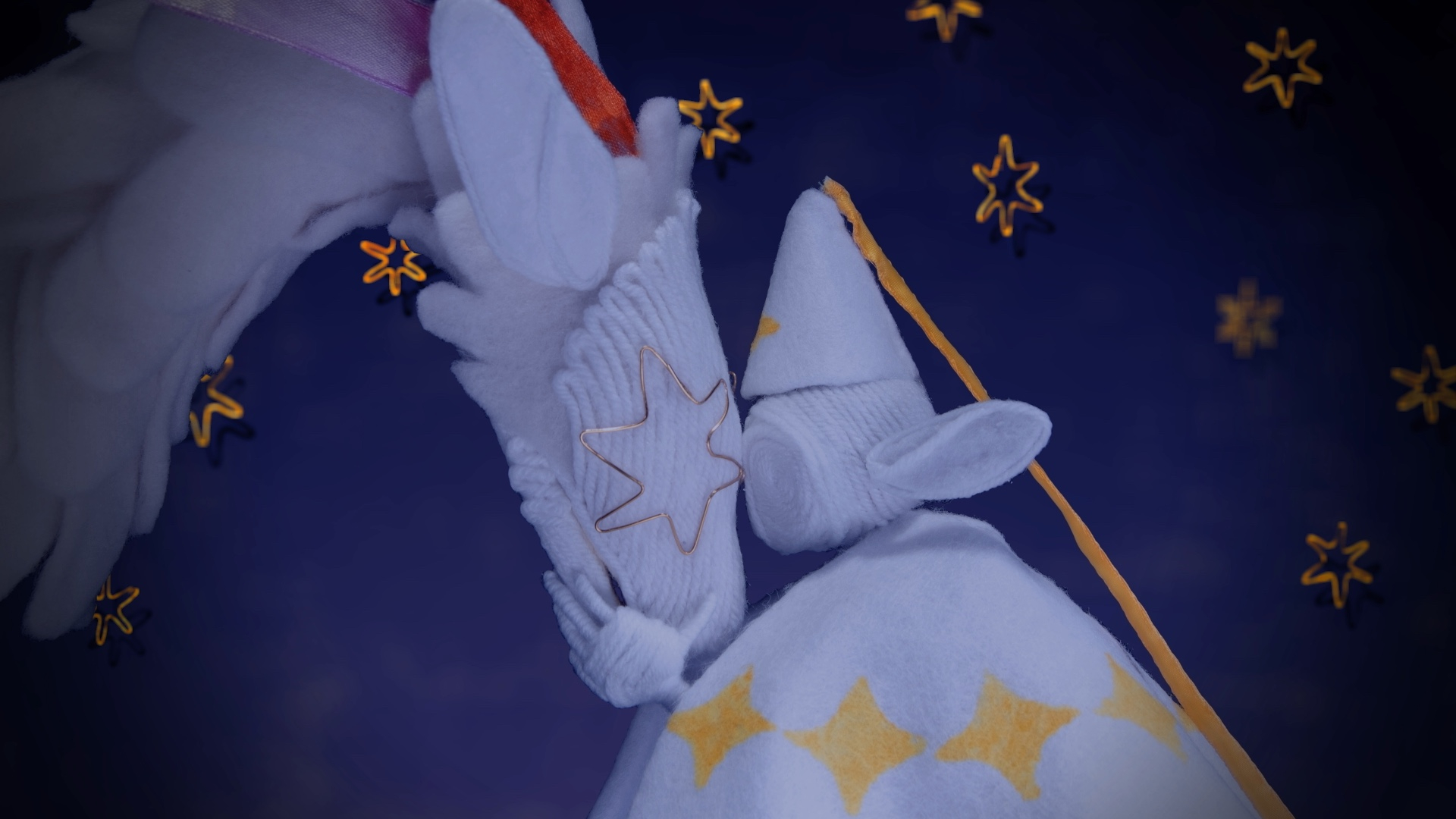 A dragon and an elf character rest their foreheads against each other