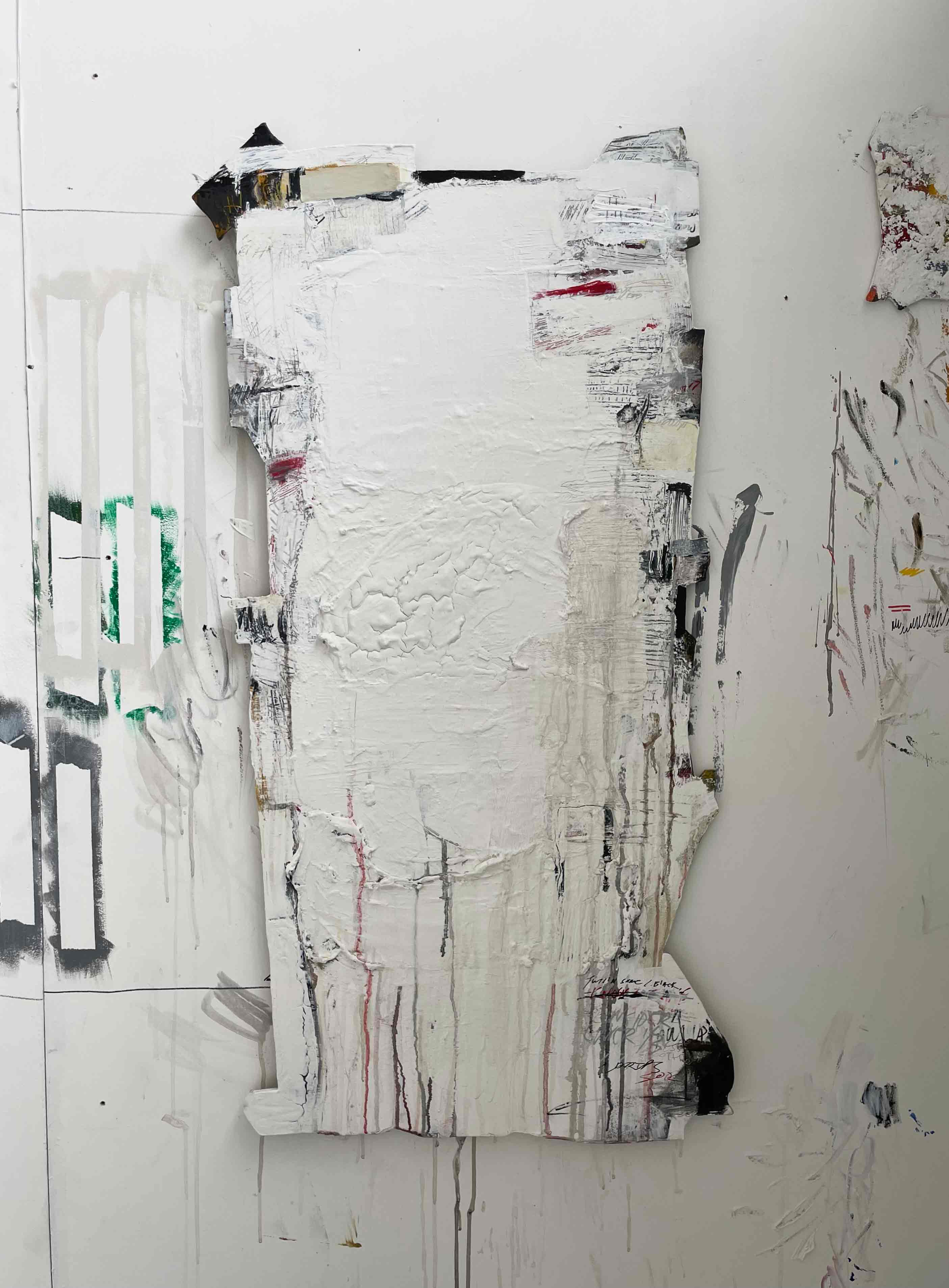 A geometric rectangular shaped wooden board, predominantly white cracked paint, containing handwritten textural elements, gestural paint marks and drips around the perimeter