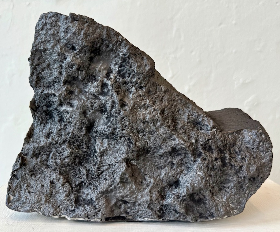 Rock from the Radical Road, 2024. Graphite powder on plaster. 