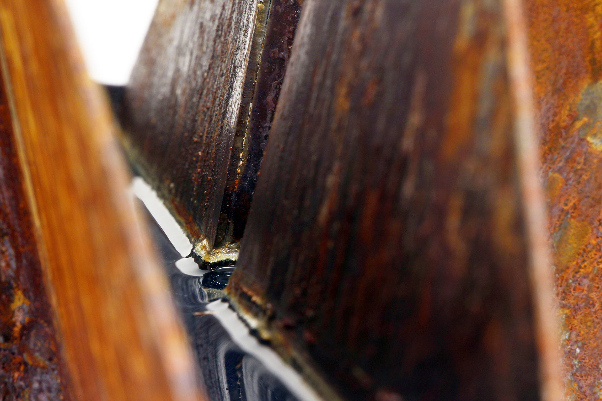 close up of rusted steel sculpture, resembling river valley