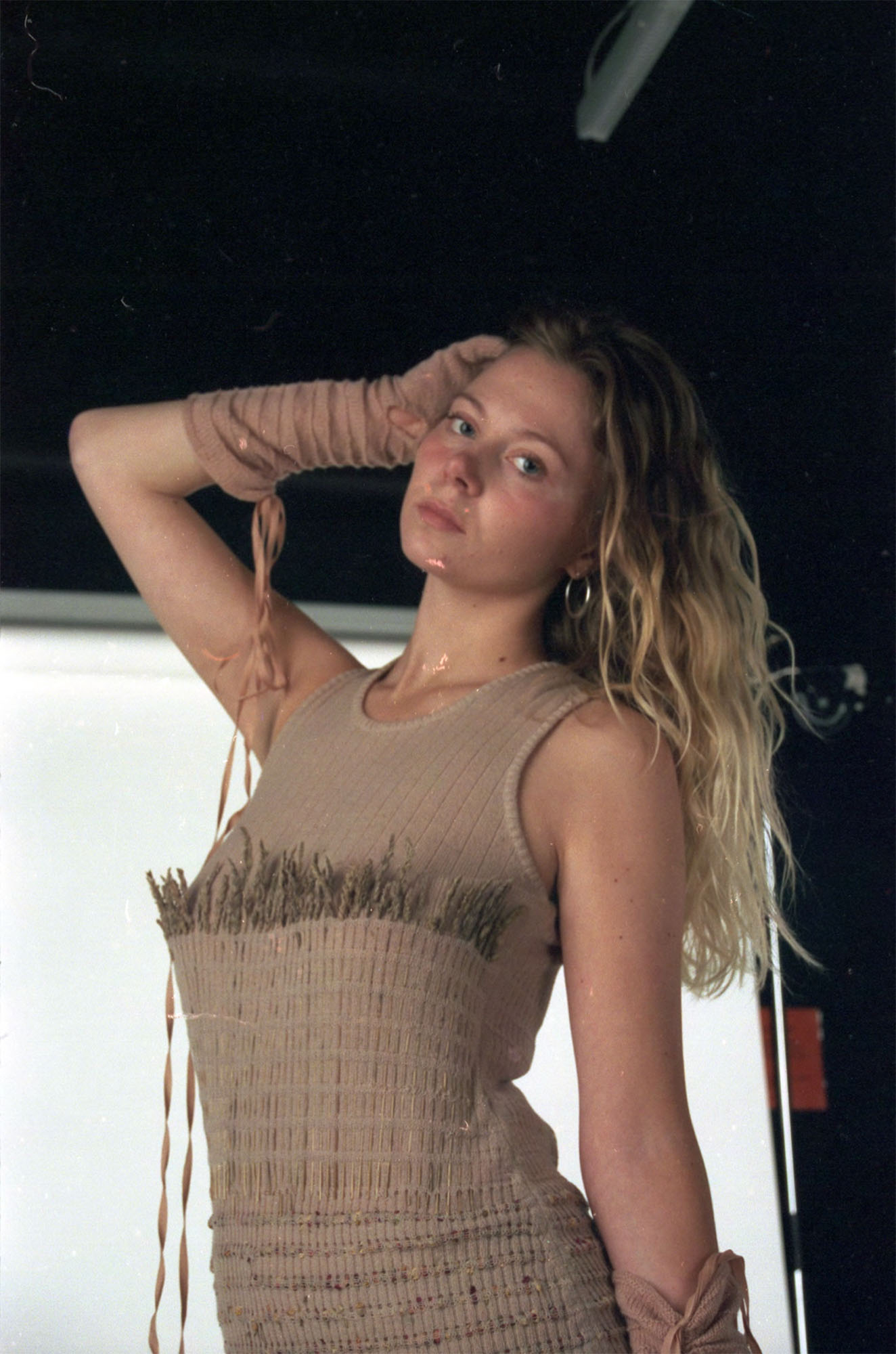 Knitted dress dyed with avocado pits, paired with linen trousers dyed with red onion skins.