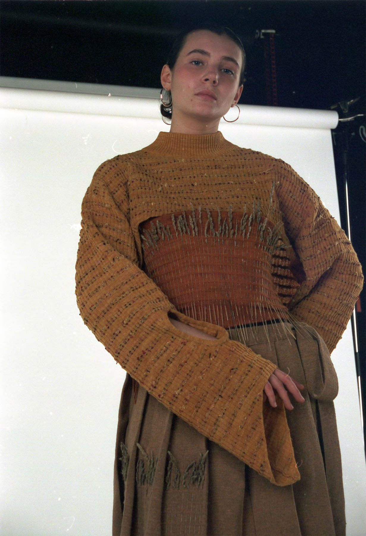 Knitted jumper and vest dyed with yellow onion skins, knitted skirt made from undid cashmere and silk.