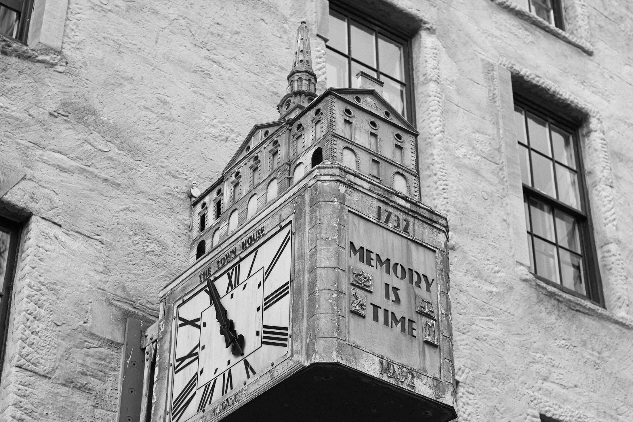 clock on wall, text on side: Memory is time