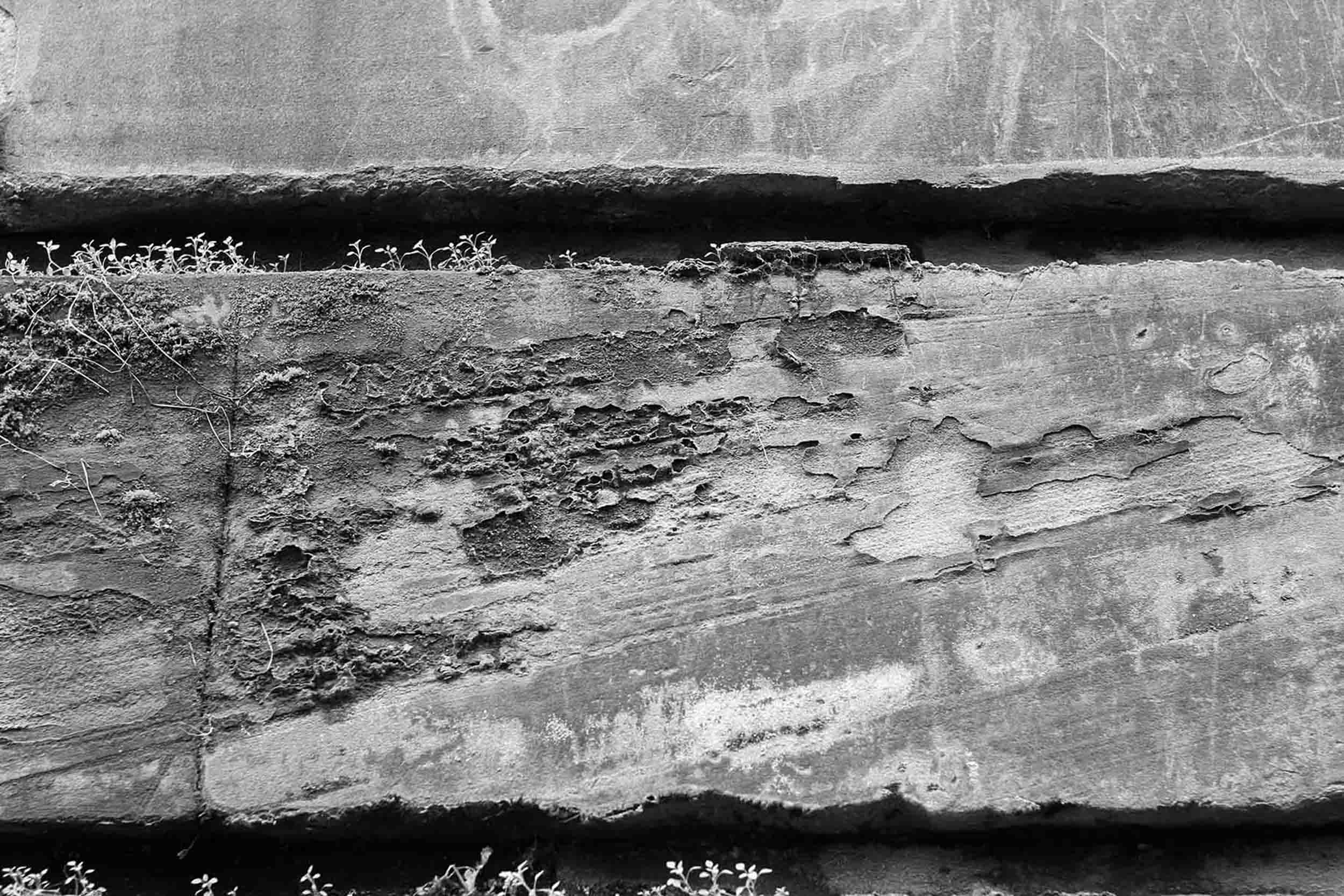 close up of a weathered stone facade