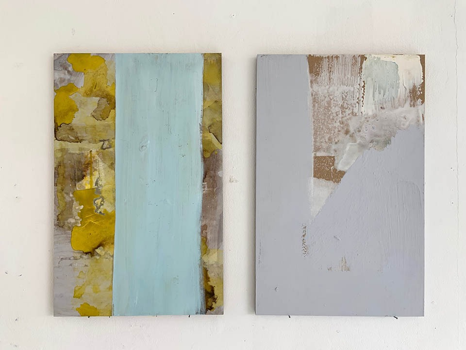 Two MDF boards with abstract yellow paint and blue and lilac blocks of paint