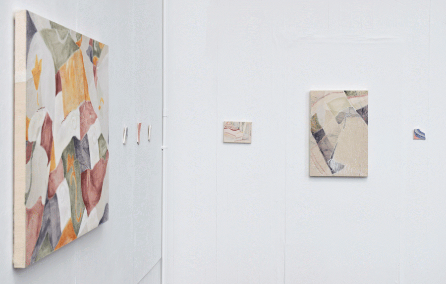 paintings and ceramics on wall 