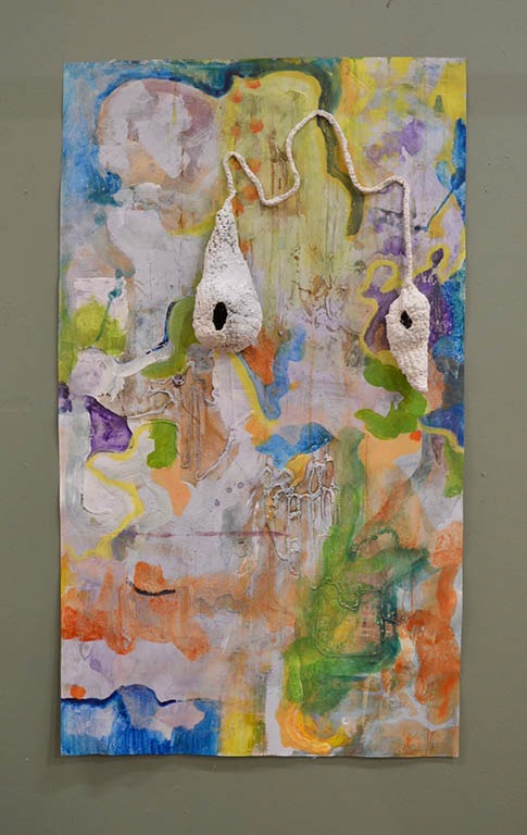 Light pastel abstract painting on a green wall with white nest sculpture over the top