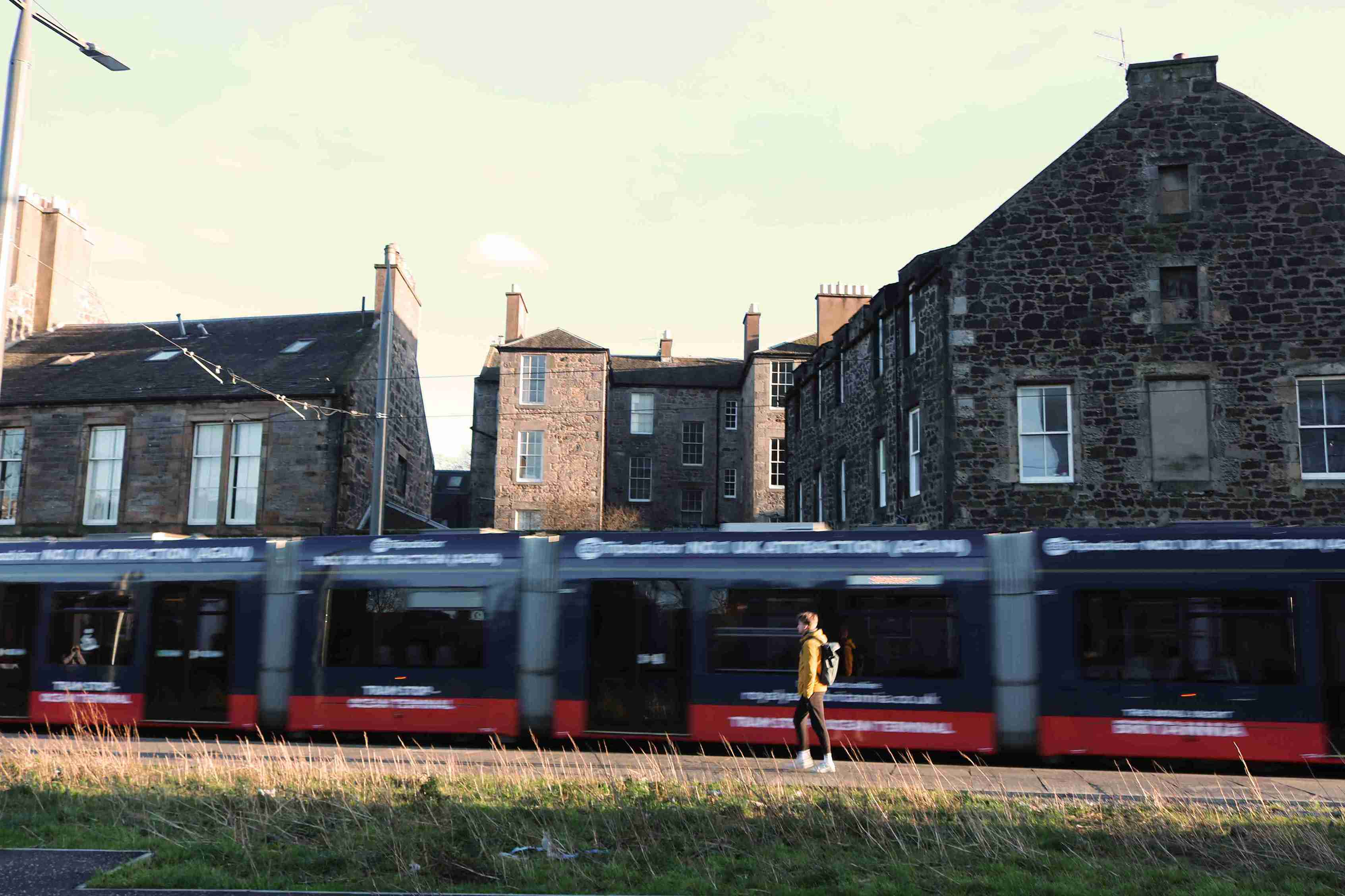 Tram passing through site