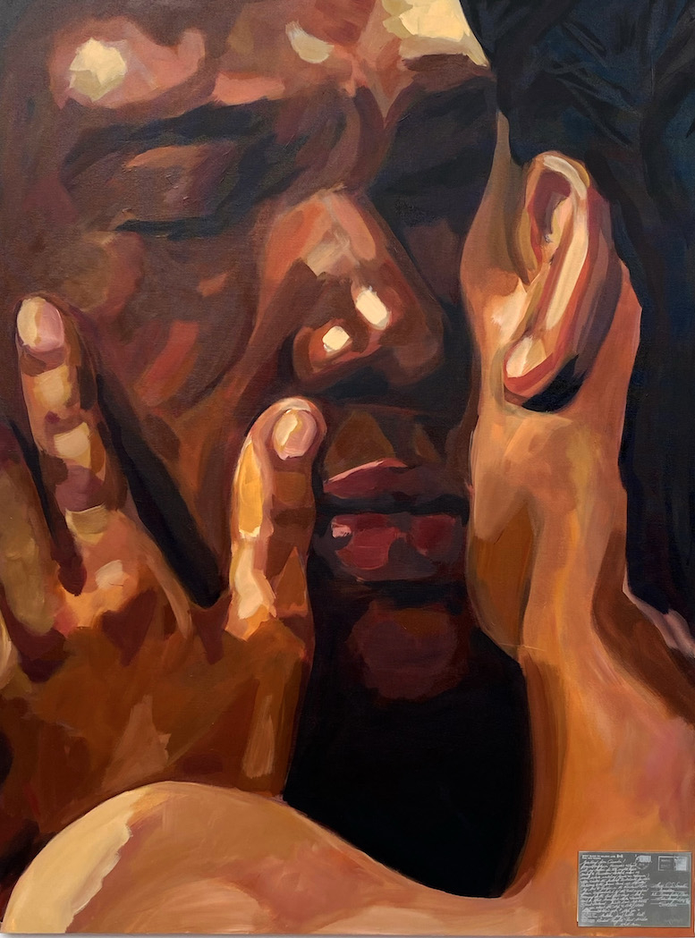 close up of a mans face with his eyes closed is centre on the canvas. To the right a back of a womans head and shoulder covers the canvas, her hand touches his cheek. Bottom right of the canvas is a metal postcard.