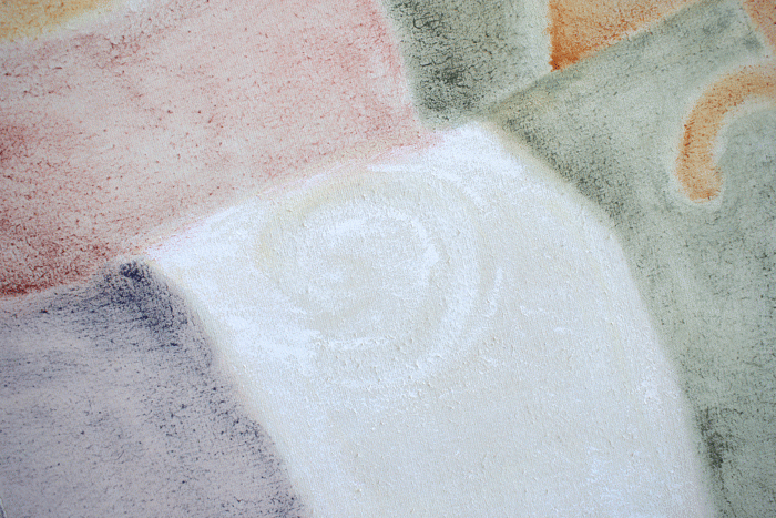 close up of painting, blocks of colour with swirl in the centre 